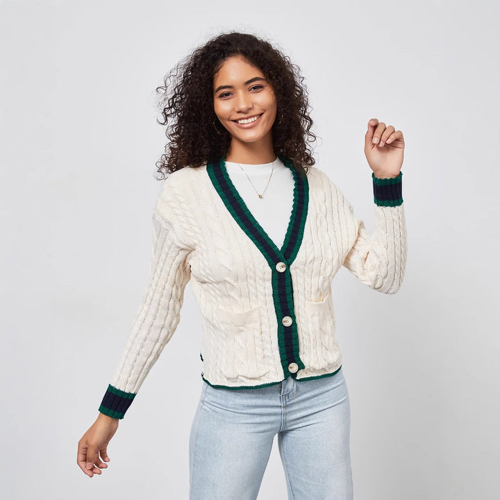 Chunky knit cardigan for women with decorative button placket and matching hem.