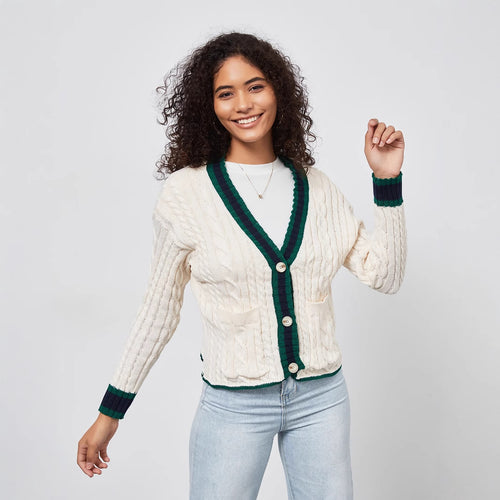 Chunky knit cardigan for women with decorative button placket and matching hem.