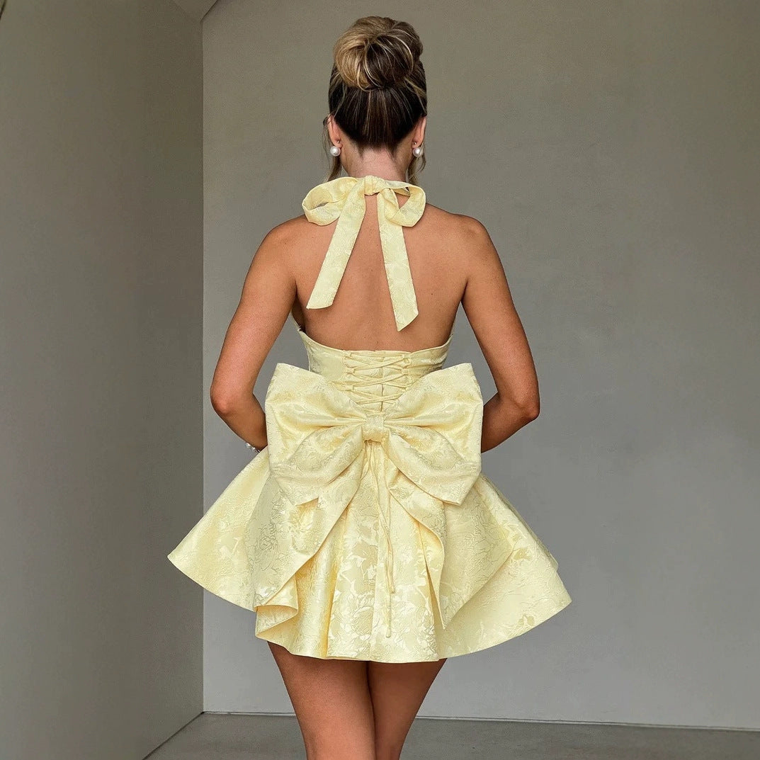 Women's skater dress with deep V-neckline and decorative bow elements