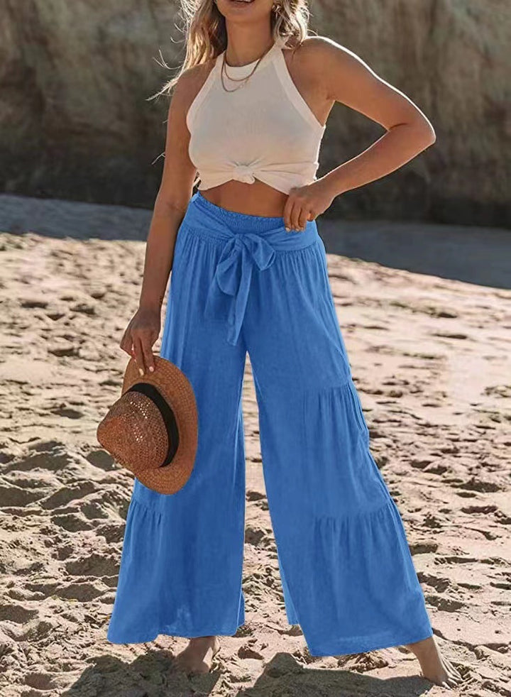 Airy palazzo pants for women with elastic waistband and practical tied belt Lune London