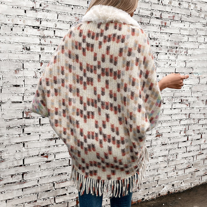 Women's elegant poncho with luxurious faux fur collar and fringes Lune London