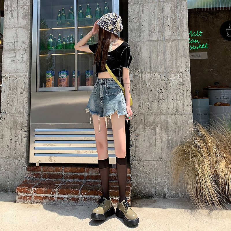 Women's denim shorts with frayed hems and unique embroidery detail Lune London