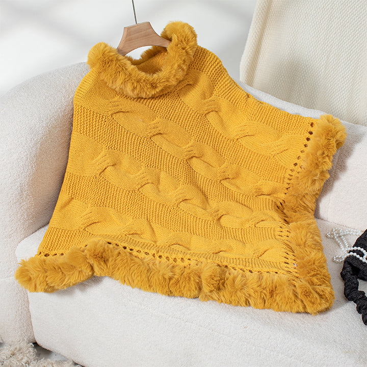 Ladies cozy poncho sweater with soft faux fur trim and cable knit pattern Lune London