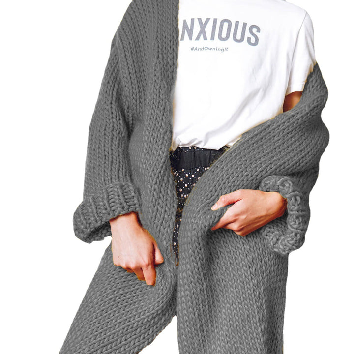 Women Large knitted coat with deep pockets and voluminous sleeves Lune London