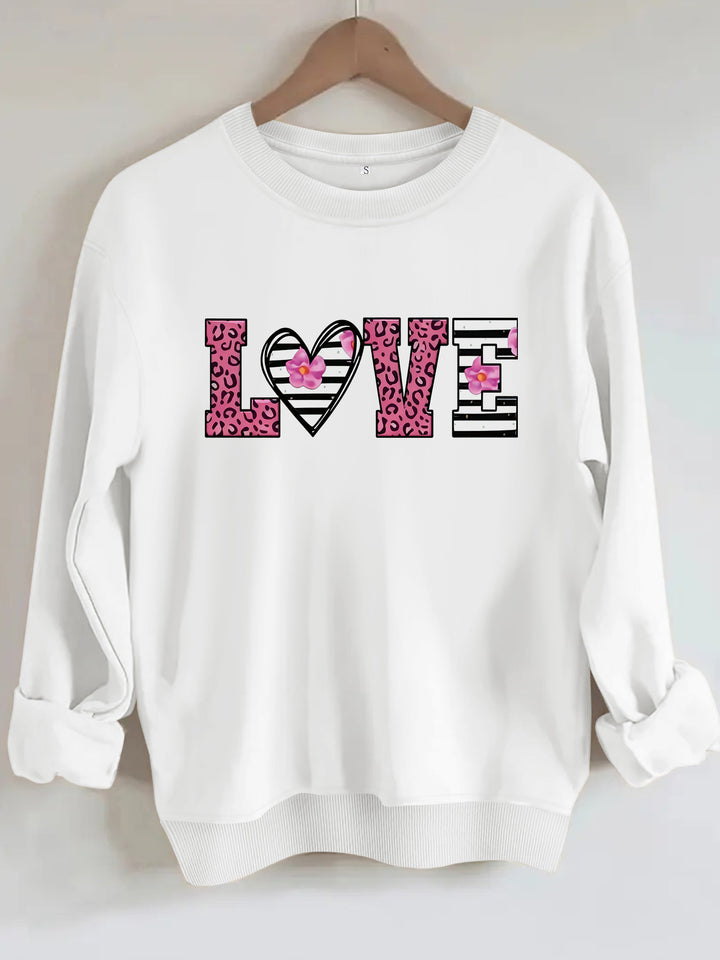 Sweatshirt femme avec design moderne de cœur léopard et coupe confortable Chic & Stil