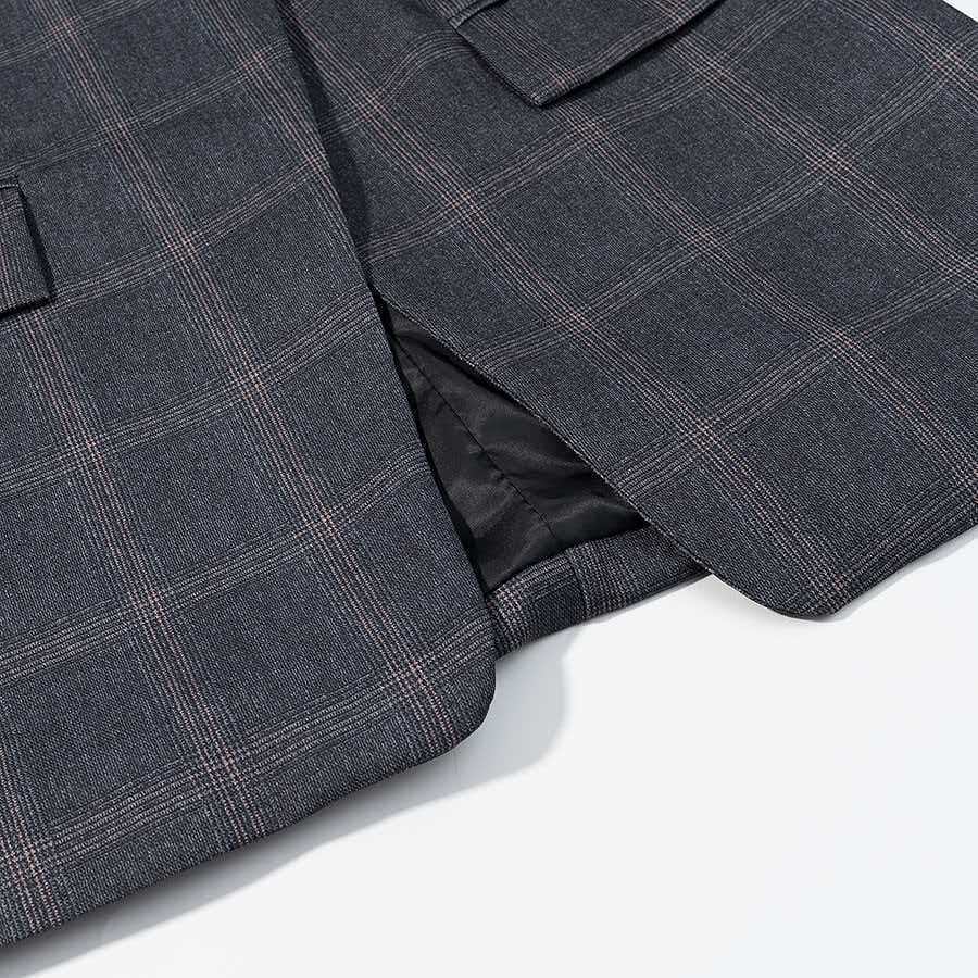 Veste à carreaux élégante pour femme avec coupe asymétrique Chic & Stil