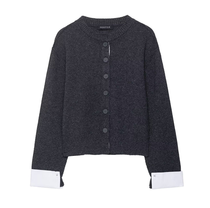 Trendy women's knitted jacket with contrasting sleeves and a continuous button placket Lune London