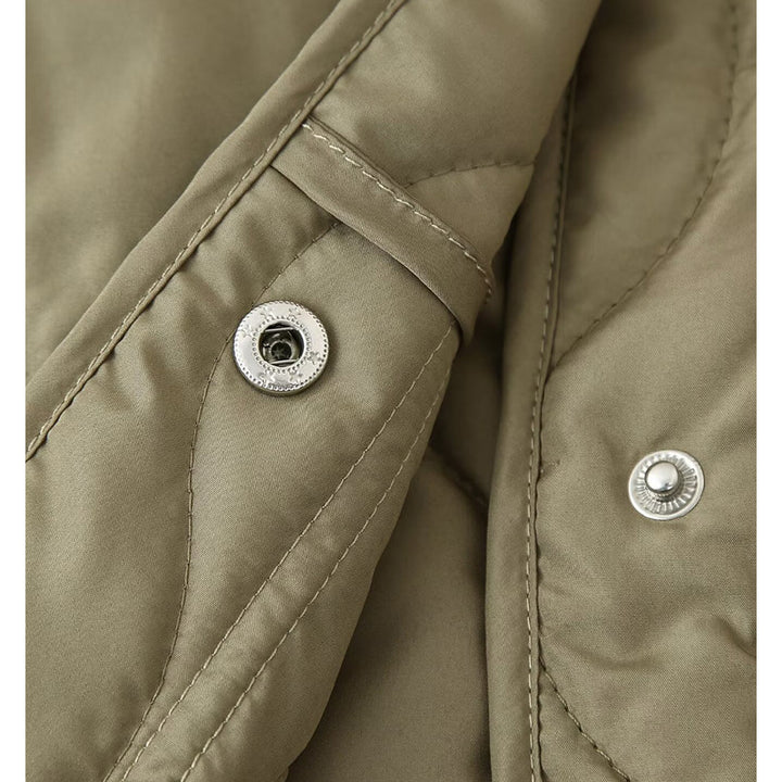Quilted transitional jacket for women with high collar and practical pockets Lune London