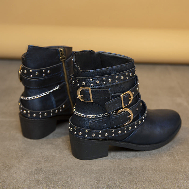 Trendy women's ankle boots with decorative straps and chain elements Lune London