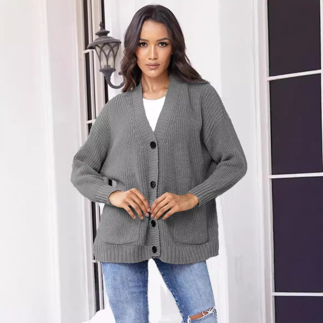 Fashionable knitted jacket for women with button closure all the way down and large pockets Lune London
