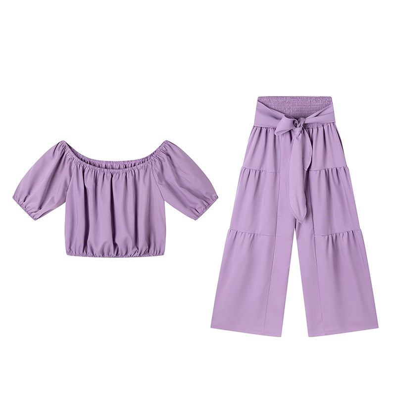 Woman Deep V-Neck Crop Top and High-Waisted Palazzo Pants Lune London
