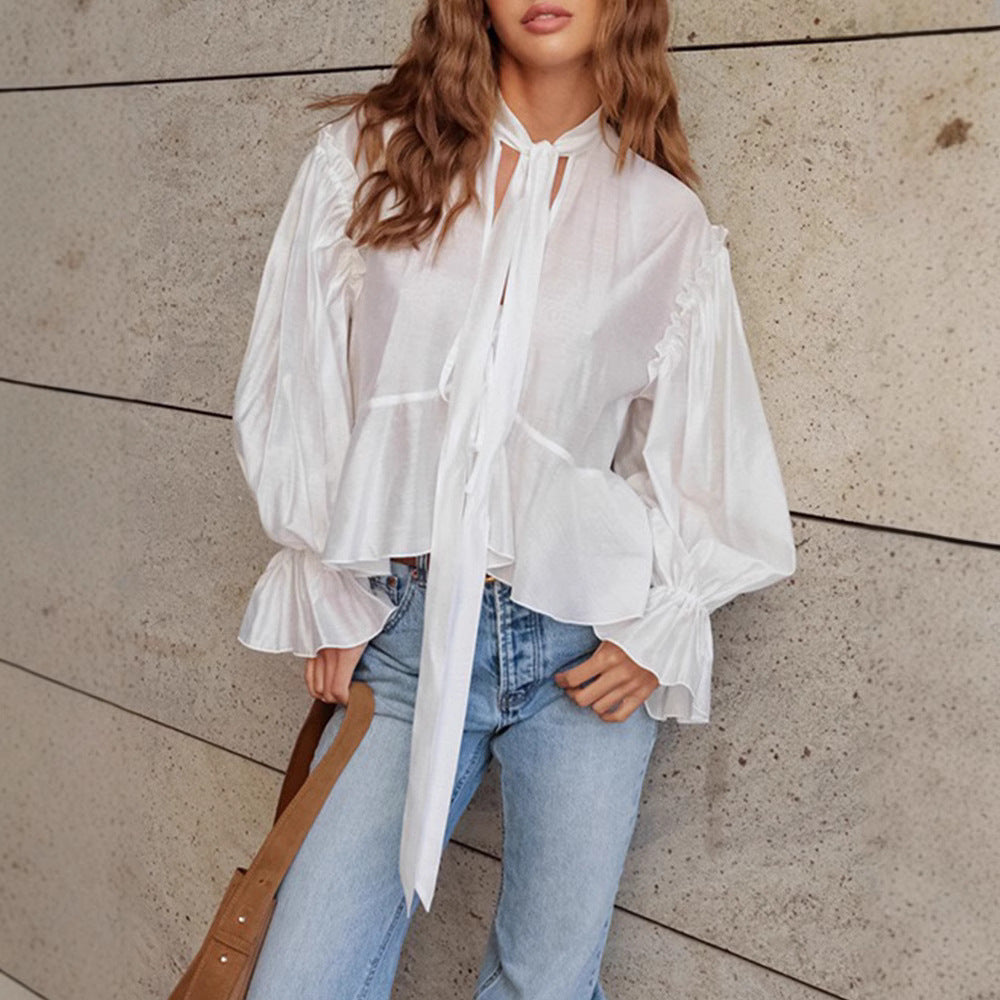 Fluid blouse for women with ruffles and a bow detail Chic und Stil