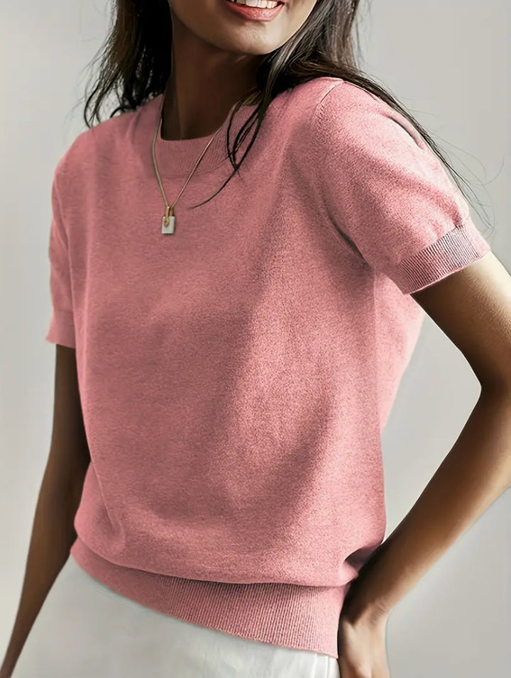 Fine knit sweater for women with a short sleeve silhouette and a soft fluid material Elegance and style
