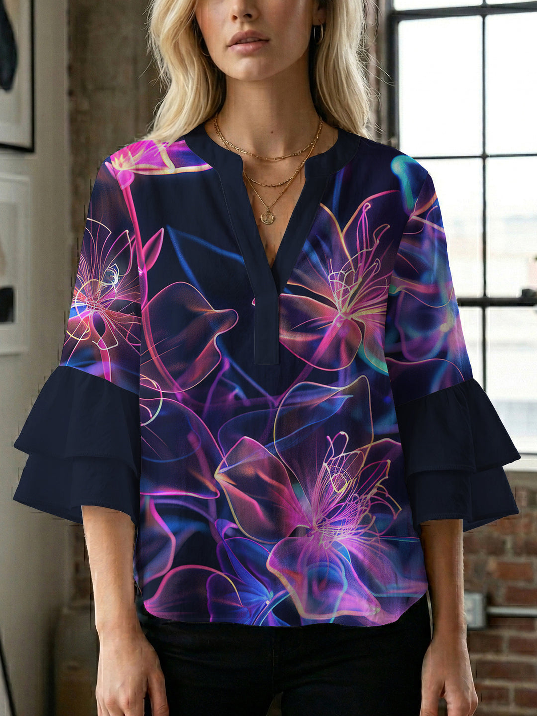 Women’s blouse with voluminous ruffled sleeves and floral pattern Lune London