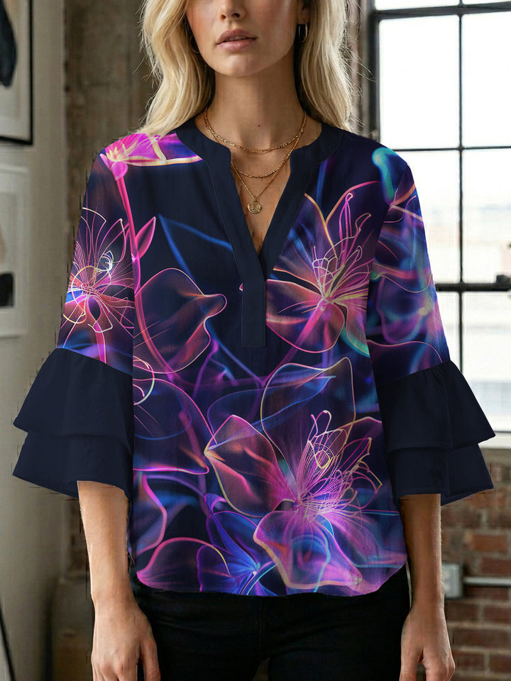 Women’s blouse with voluminous ruffled sleeves and floral pattern Lune London