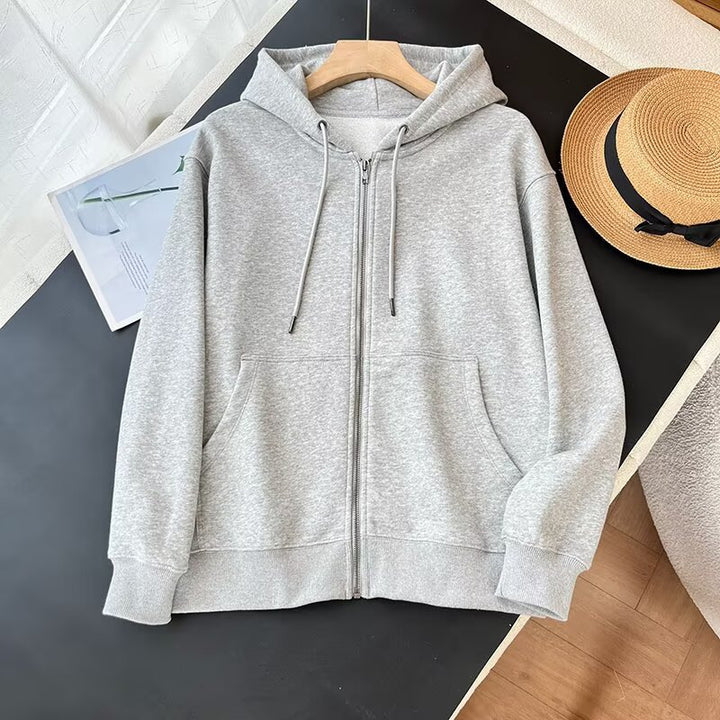 Veste à capuche zippée sportive pour femme avec poches kangourou pratiques Chic & Stil
