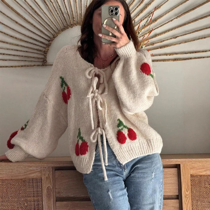 Women's knitted jacket with playful cherry pattern and decorative bows Lune London