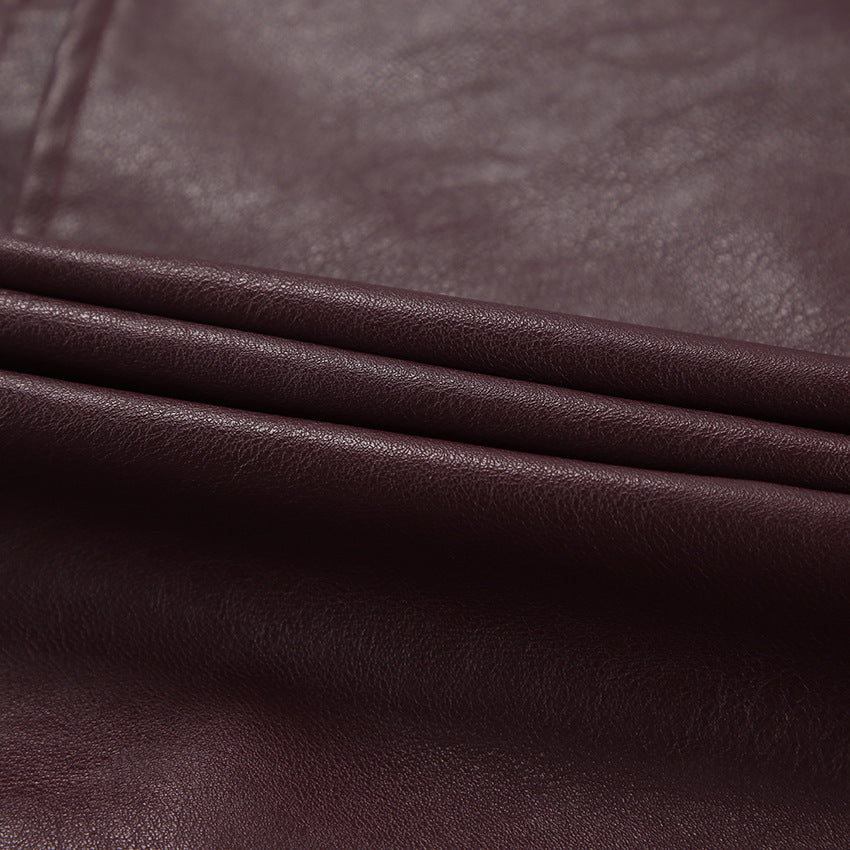 Synthetic leather biker jacket for women with a slim fit and chic metal zippers.