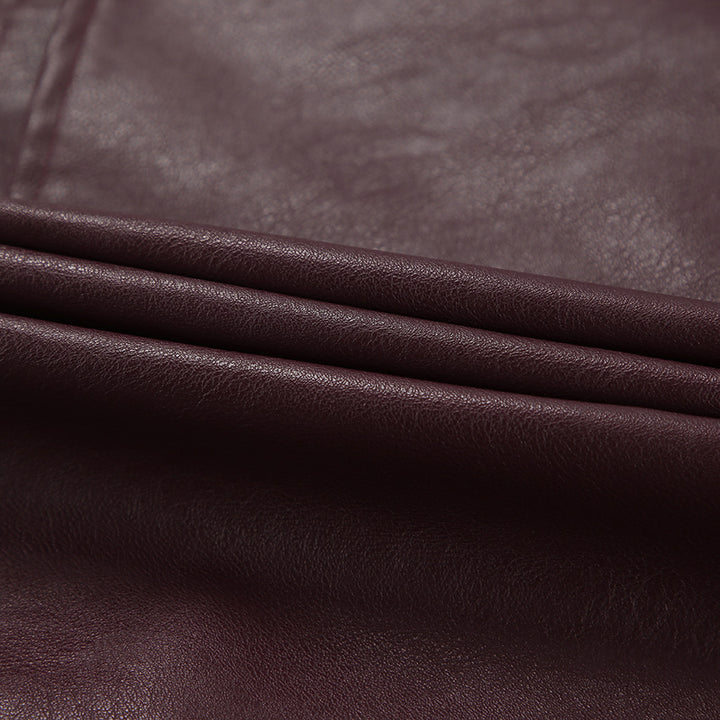 Synthetic leather biker jacket for women with a slim fit and chic metal zippers.