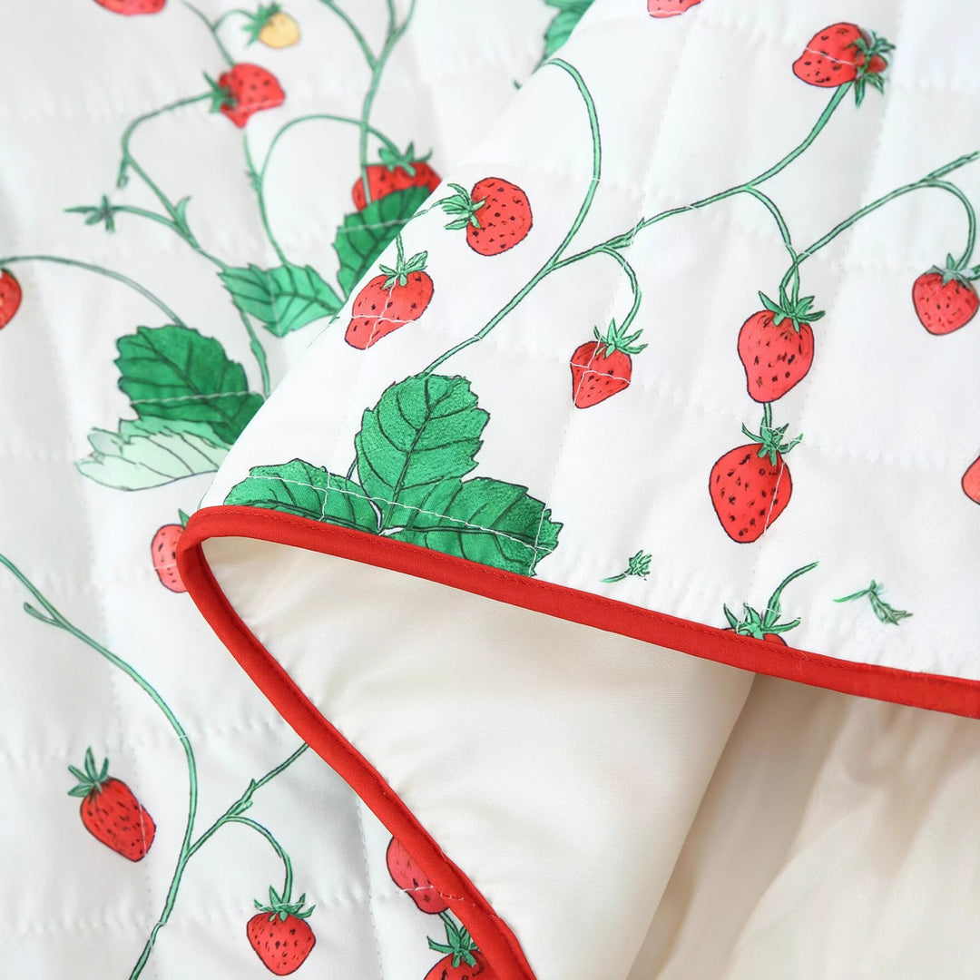 Quilted jacket for women with a cheerful strawberry pattern and practical pockets Lune London