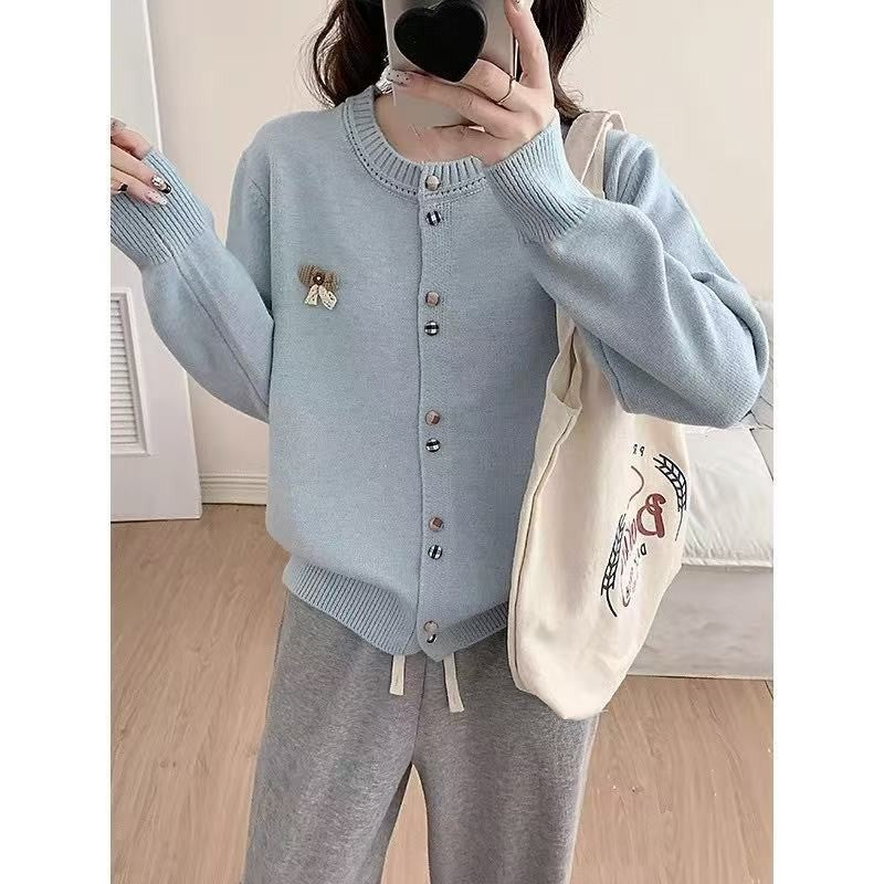 Ladies comfortable knitted cardigan with shiny buttons and decorative application Lune London
