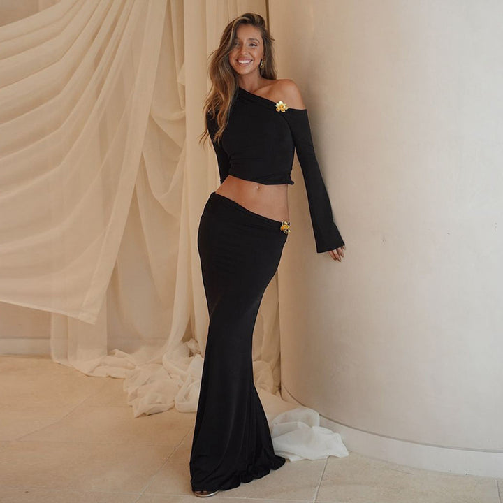 Elegant maxi dress for ladies with an asymmetrical one-shoulder design and long sleeves. Lune London.
