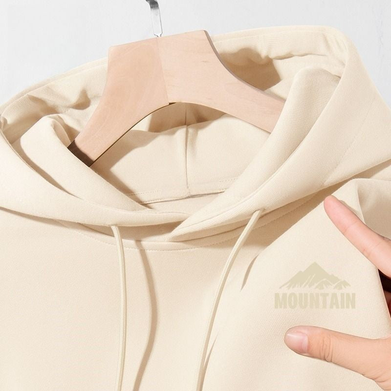 Women's hoodie with modern mountain motif and practical pockets Chic & Stil