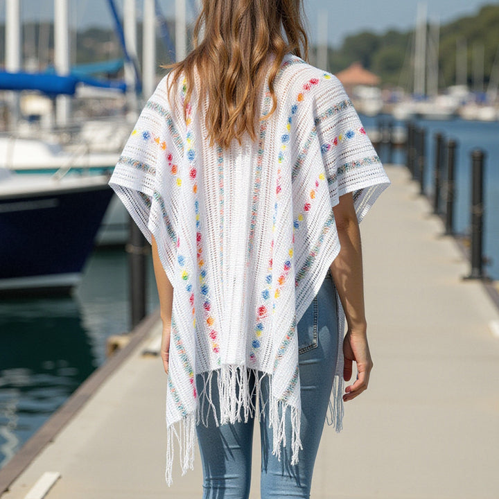 Ladies casual poncho with fringe details and a chic and stylish colorful pattern