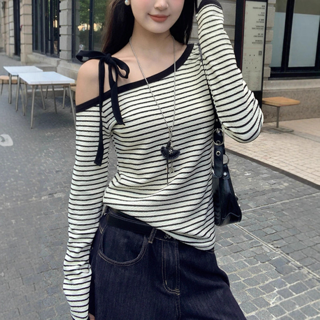 Women's off-shoulder long-sleeve shirt with striped design and decorative bow details Chic & Stil