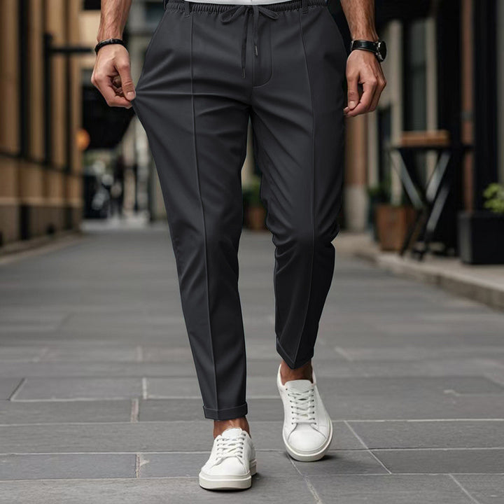 Men's fashionable sports pants with elastic waistband and practical welt pockets Lune London