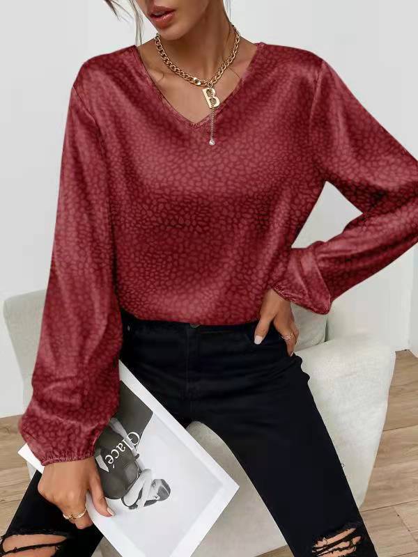 Blouse élégante pour femmes avec col en V et manches volumineuses Chic & Stil