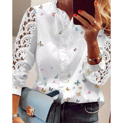 Women's blouse with floral appliqués, ruffle details, and lace sleeves Lune London