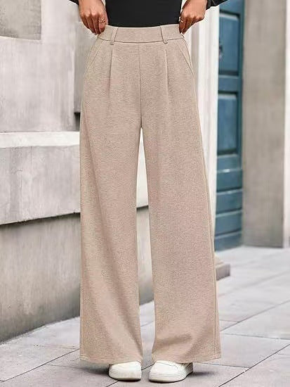 Loose fabric trousers for women with high waist and practical pockets. Chic and style