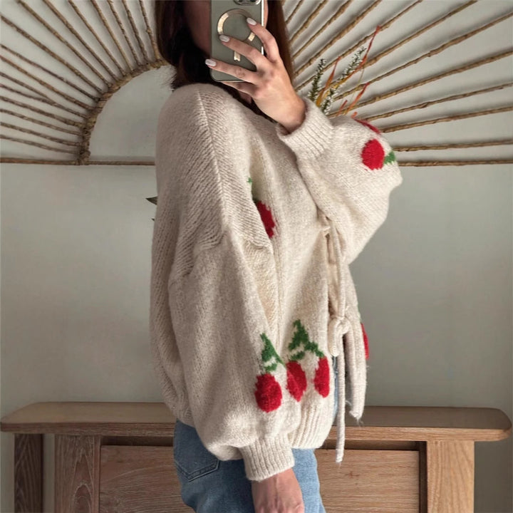 Women's knitted jacket with playful cherry pattern and decorative bows Lune London