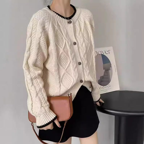 Thick knit women’s jacket with cable pattern and decorative buttons Lune London