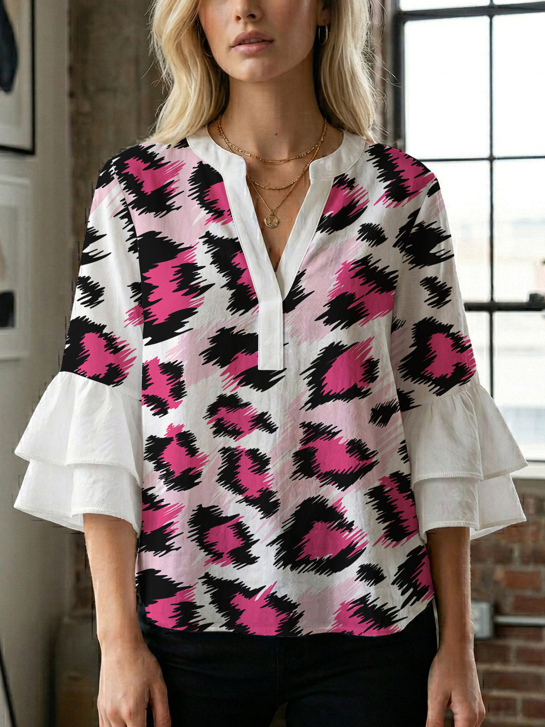 Women's blouse with ruffle details and eye-catching animal print Lune London