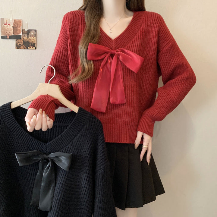 Knitted sweater for women with V-neck and decorative bow accent Lune London