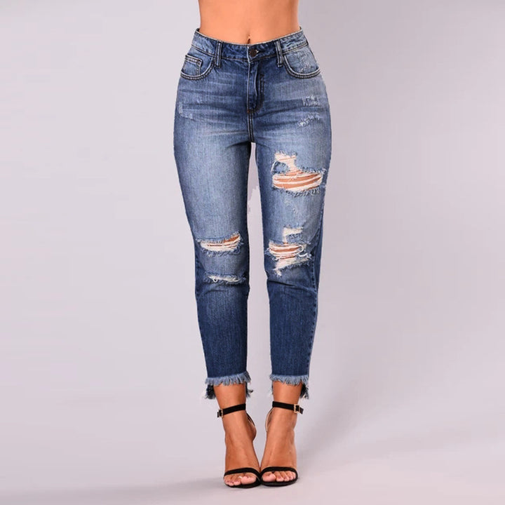 High-waisted jeans for women with a modern destroyed look featuring a trendy frayed hem Lune London