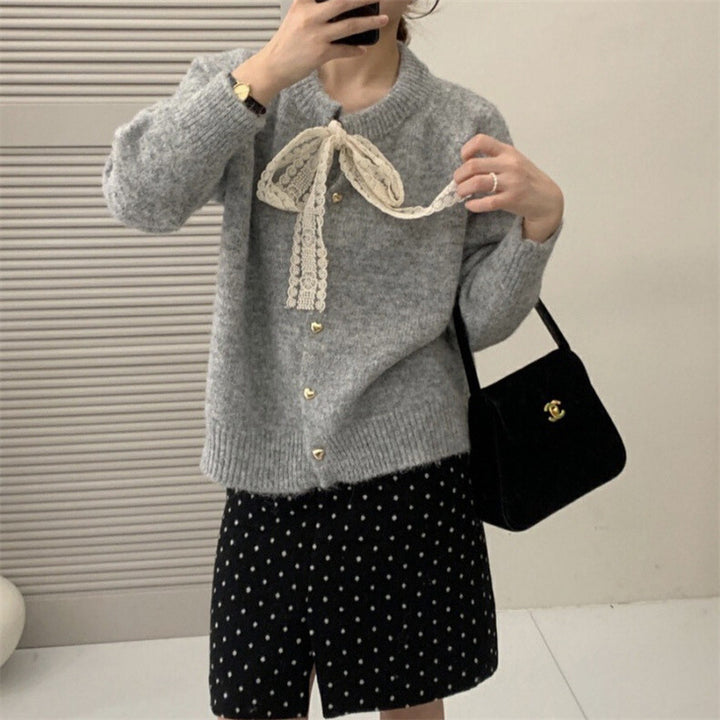 Women's knit jacket with playful lace ribbon and golden heart-shaped buttons Lune London
