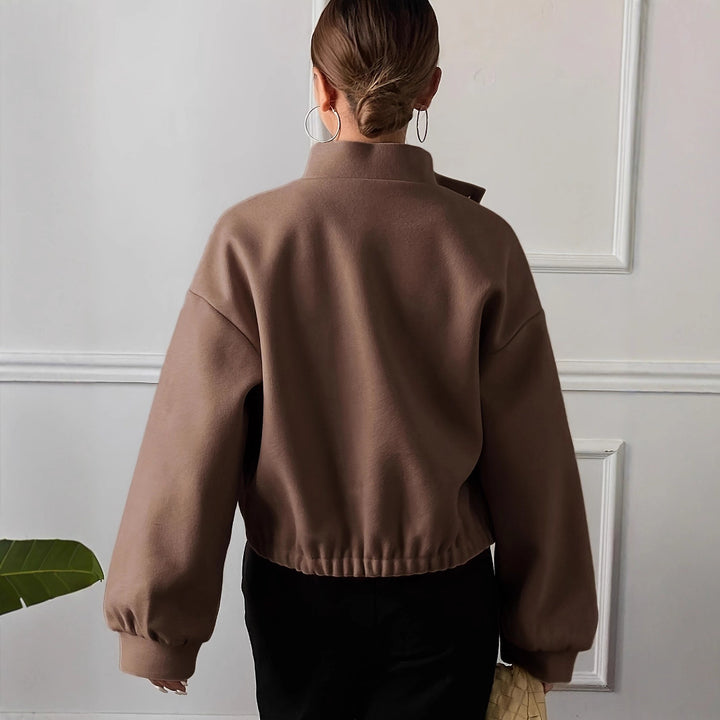Fashionable short jacket for women with practical flap pockets and a chic stand-up collar