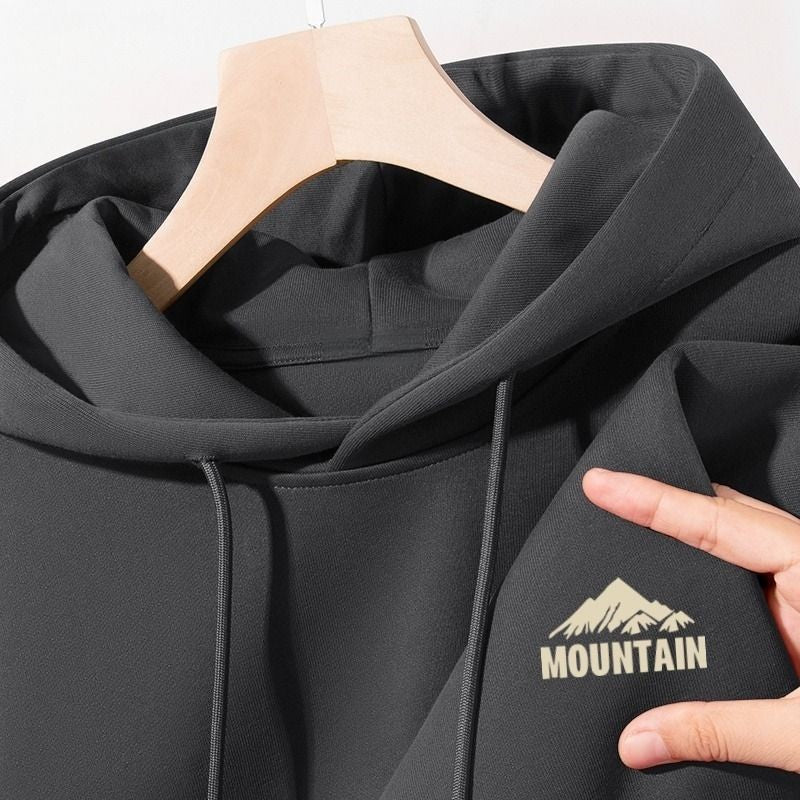 Women's hoodie with modern mountain motif and practical pockets Chic & Stil
