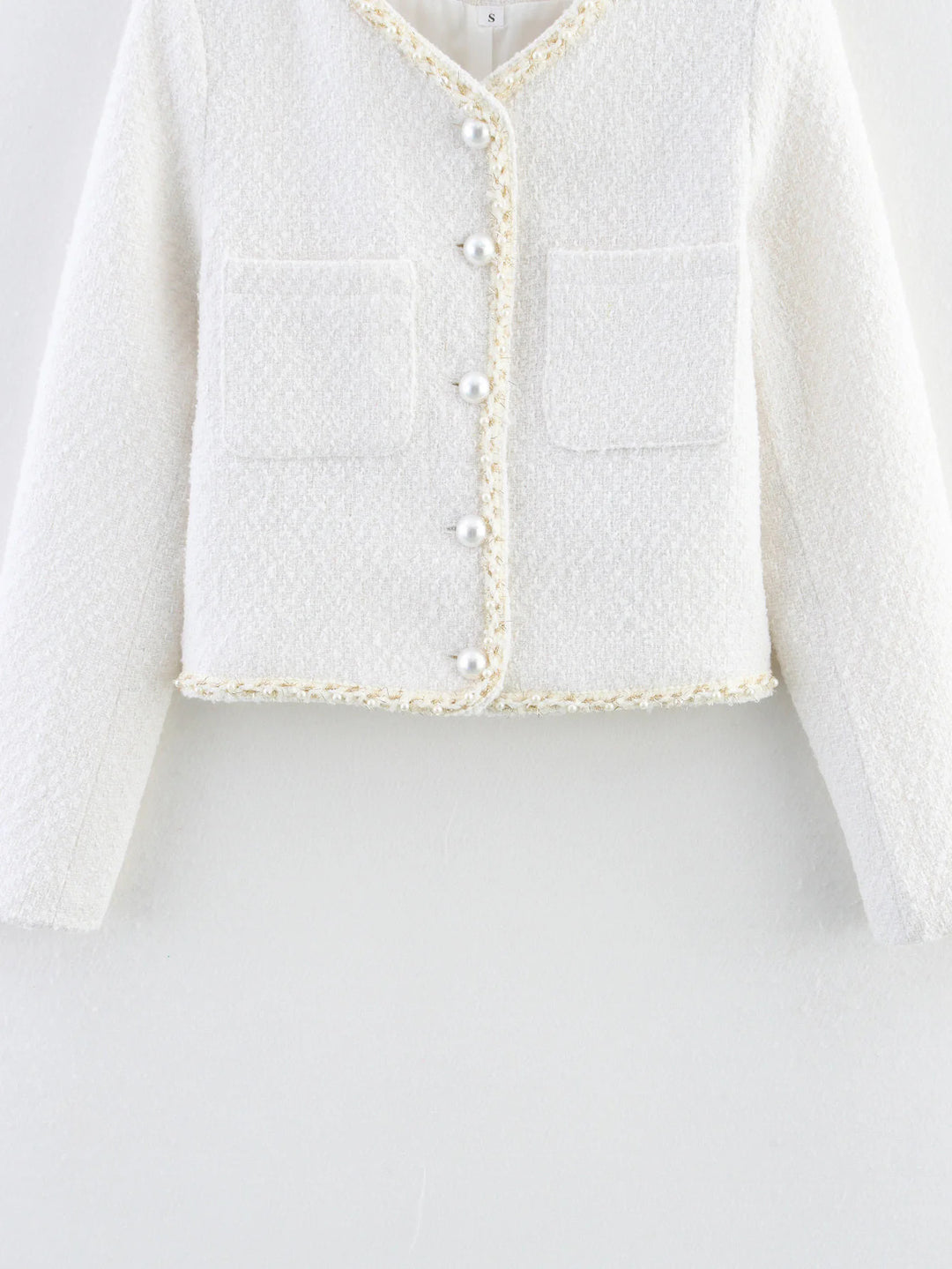 Elegant short-sleeve women's jacket with pearl-adorned buttons and patch pockets Lune London