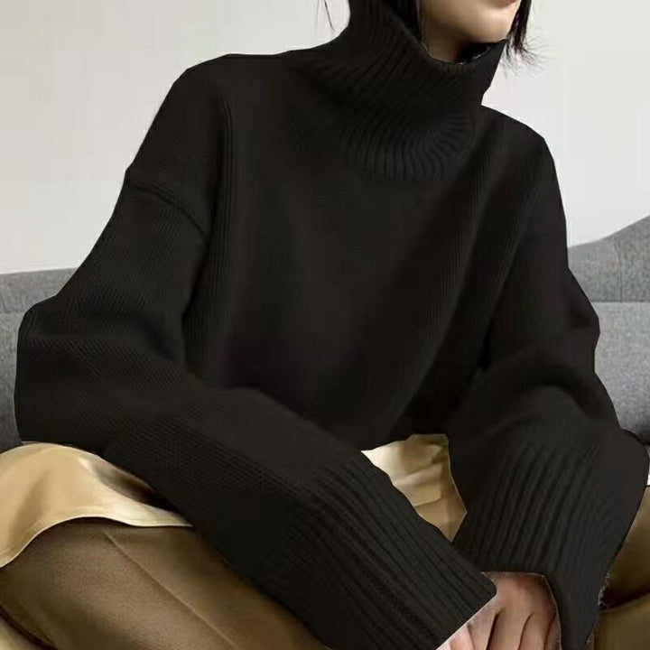 Pull col roulé pour femmes avec des manches larges et une structure en ribbing Chic & Stil