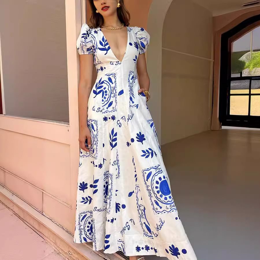 Maxi dress for women with voluminous puff sleeves and floral patterns Lune London