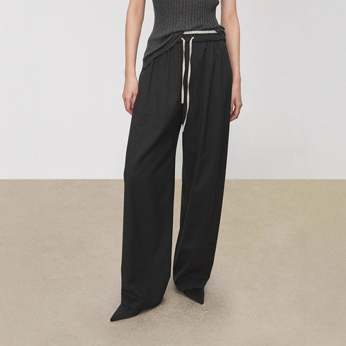 Pantalons en tissu large pour femmes avec taille élastique et poches pratiques Chic & Stil