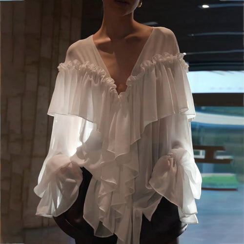 Blouse for women with voluminous ruffle details and an elegant button placket Lune London