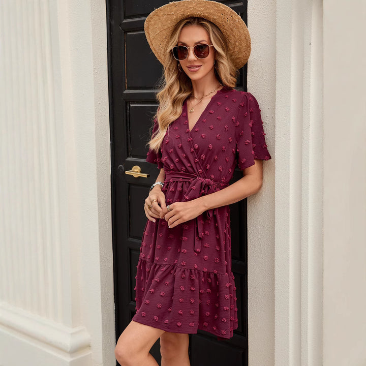 V neck wrap dress for women with a belt at the waist and textured fabric Lune London