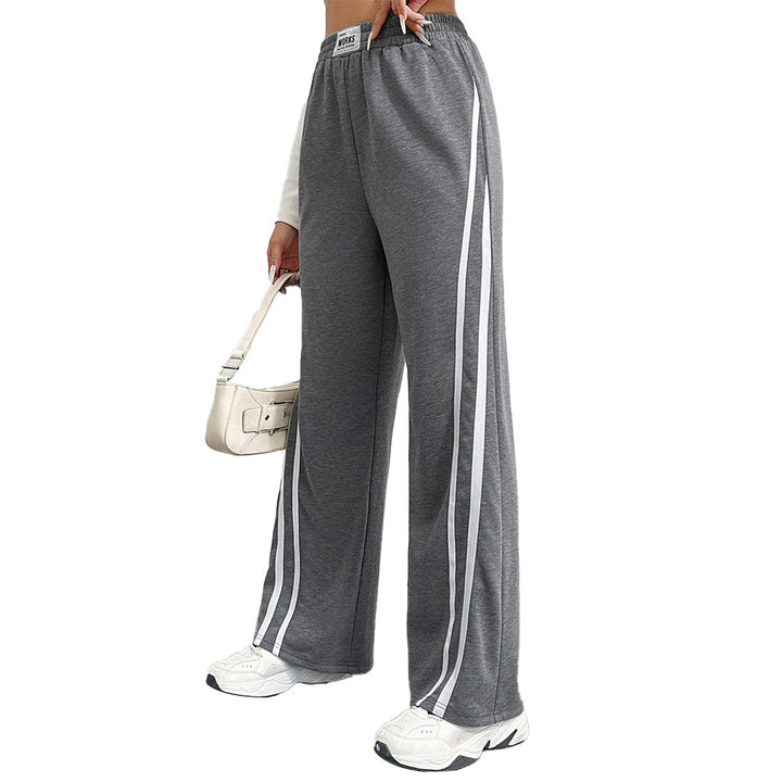 Pantalons de loisirs sportifs pour femmes avec coupe large et rayures contrastées Chic & Stil