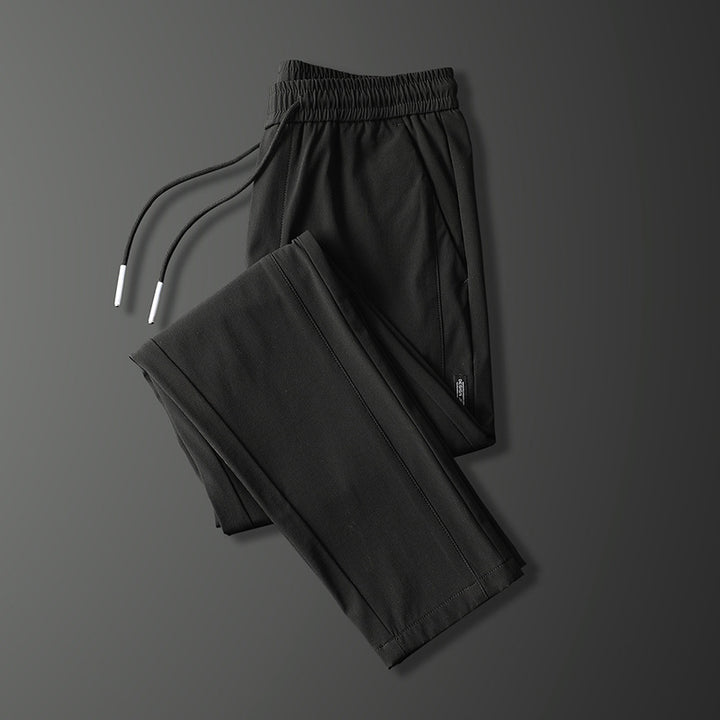 Men's sports pants with adjustable drawstring and zippered pockets on the sides Lune London