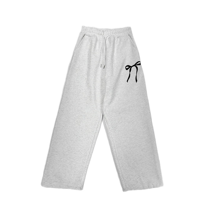 Women's loose leisure pants with elastic waistband and decorative bow motif Chic & Stil